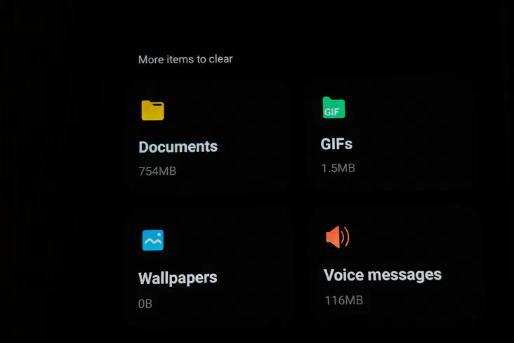Phone storage screen listing Documents, GIFs, Wallpapers, and Voice messages with their file sizes