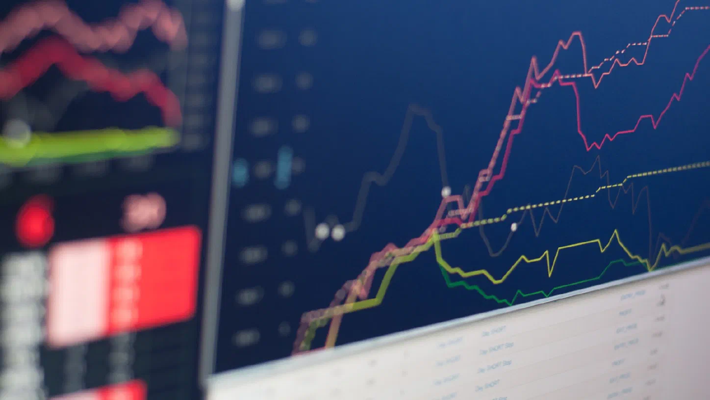 A close-up photo of a computer monitor displaying a line graph